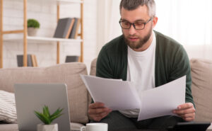 A man deciding what documents to bring to a legal appointment