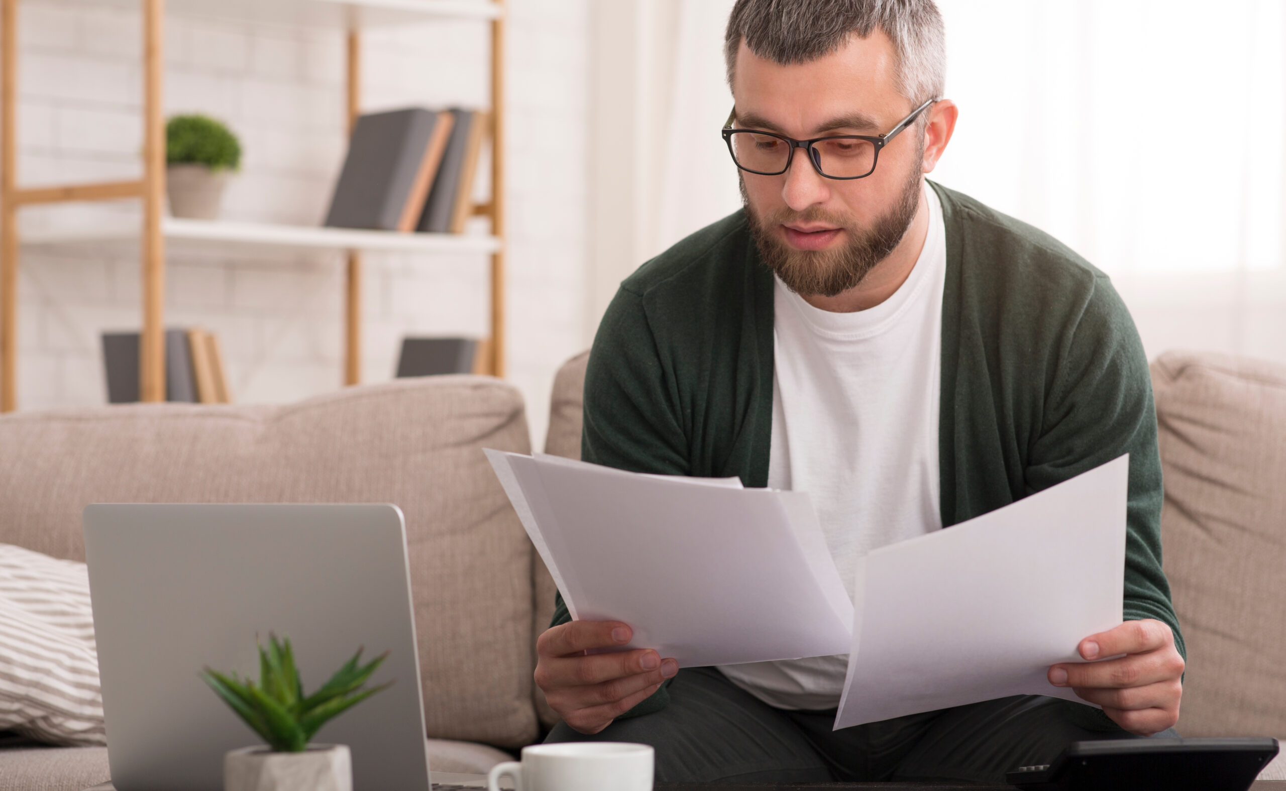 A man deciding what documents to bring to a legal appointment